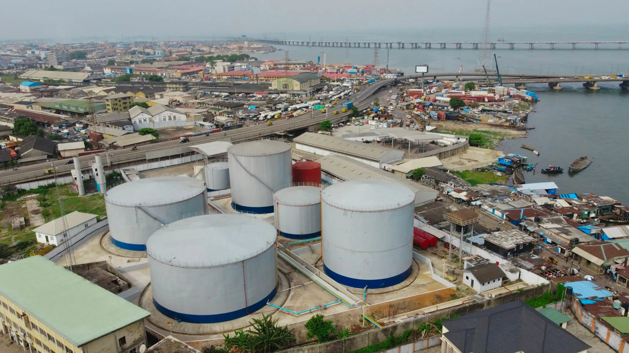 Fuel storage tanks beside the lagoon at Ijora, Lagos, seen from above
